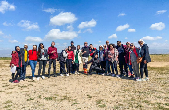 Photo de groupe à l'aeroport skydiving aventure au maroc happy trip
